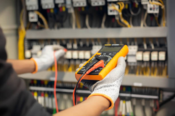 Electrician testing consumer unit in Bradford